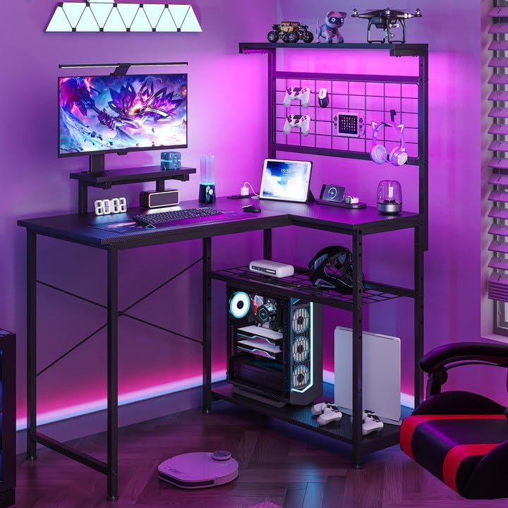 L Shaped Gaming Desk, Reversible Computer Desk with 4-Tier Shelves, Corner Desk with Pegboard, Home Office Desk with LED Lights & Power Outlets Gaming Desk with Storage, Carbon Fiber Black