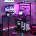 L Shaped Gaming Desk, Reversible Computer Desk with 4-Tier Shelves, Corner Desk with Pegboard, Home Office Desk with LED Lights & Power Outlets Gaming Desk with Storage, Black